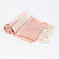 Telo mare rosa salmone a righe in cotone