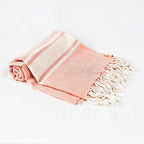 Telo mare rosa salmone a righe in cotone